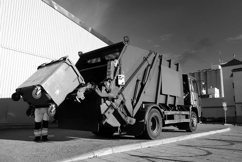 Junk removal team sorting recyclable materials for recovery