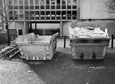 Rubbish removal team handling household waste in a London street