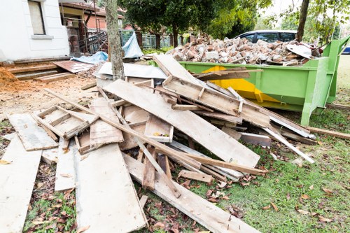Workers removing household rubbish from a London property