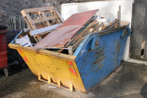 Bulky sofa being collected from a London flat with stairs