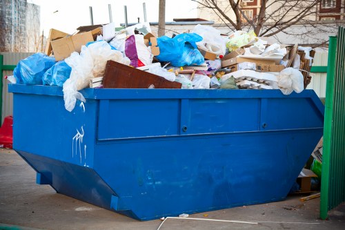 Service manager reviewing a junk hauling complaint