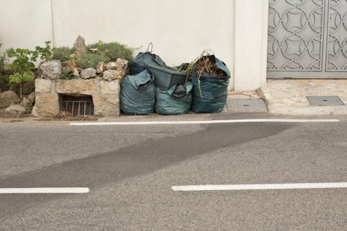 Junk removal team preparing safely with protective gear