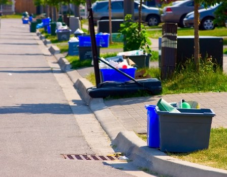 Local removal crew handling bed disposal on a London residential street
