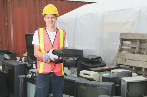 Workers assessing hazards during a junk removal job